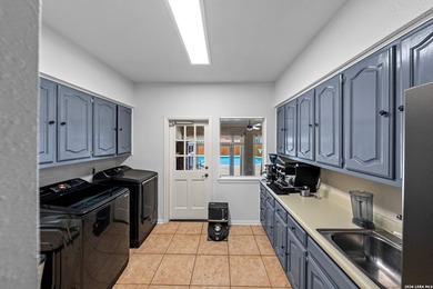 Set on a full acre in the exclusive gated community of Raintree - photo 30