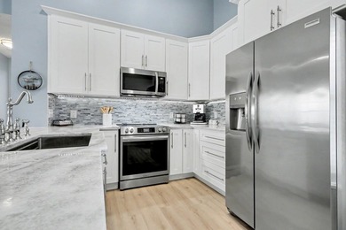 Experience coastal living in a beautifully updated home located - photo 11
