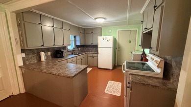 This unique 1-bedroom, 1-bath property sits on .44 acres shaded