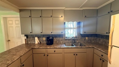 This unique 1-bedroom, 1-bath property sits on .44 acres shaded