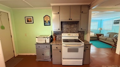 This unique 1-bedroom, 1-bath property sits on .44 acres shaded