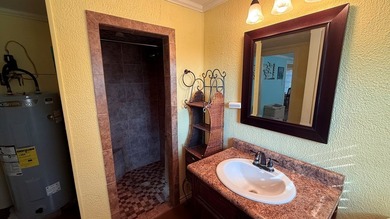 This unique 1-bedroom, 1-bath property sits on .44 acres shaded