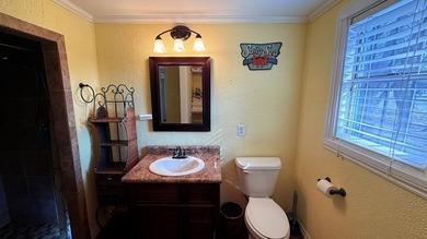 This unique 1-bedroom, 1-bath property sits on .44 acres shaded