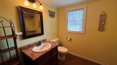 This unique 1-bedroom, 1-bath property sits on .44 acres shaded