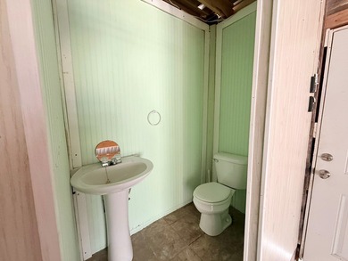 This unique 1-bedroom, 1-bath property sits on .44 acres shaded