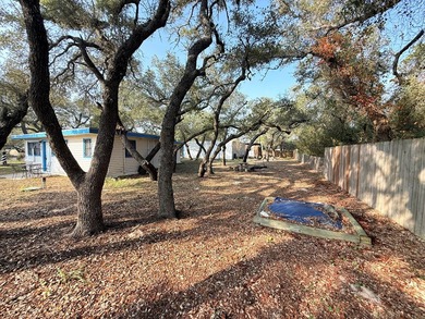 This unique 1-bedroom, 1-bath property sits on .44 acres shaded