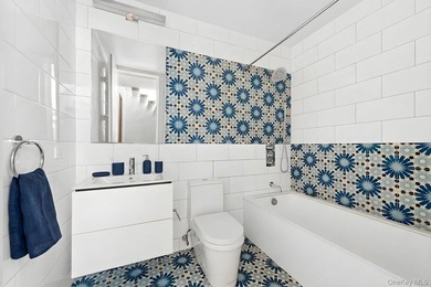 A fully renovated two-family townhouse spanning approximately 3 - photo 13