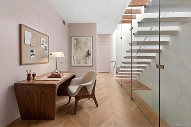 A fully renovated two-family townhouse spanning approximately 3 - photo 15