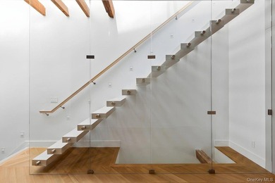 A fully renovated two-family townhouse spanning approximately 3 - photo 16