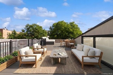 A fully renovated two-family townhouse spanning approximately 3 - photo 17