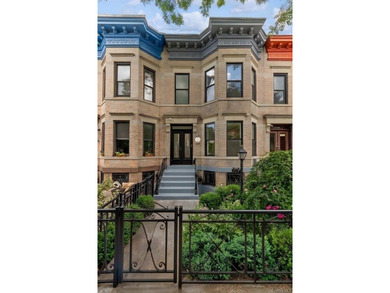 A fully renovated two-family townhouse spanning approximately 3 - photo 19