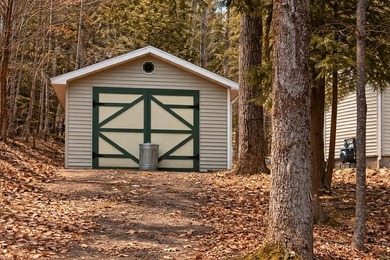 Tucked away in the heart of Up North Michigan, this charming - photo 16