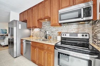 RARELY AVAILABLE sophisticated 1st floor residence in the highly - photo 12
