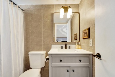 RARELY AVAILABLE sophisticated 1st floor residence in the highly - photo 14
