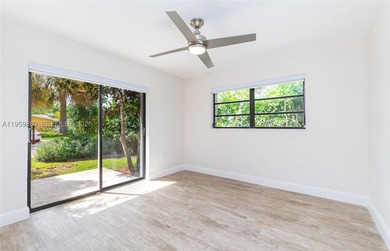 Remodeled 4-bedroom, 2-bath custom-built home featuring an open - photo 15