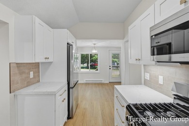 Enjoy views of Bostwick Lake from this completely updated home - photo 12
