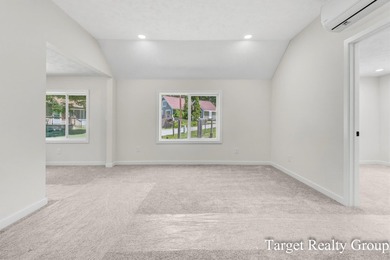 Enjoy views of Bostwick Lake from this completely updated home - photo 15