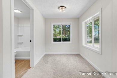 Enjoy views of Bostwick Lake from this completely updated home - photo 19