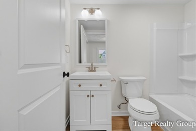Enjoy views of Bostwick Lake from this completely updated home - photo 21