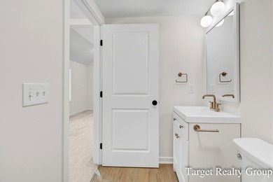 Enjoy views of Bostwick Lake from this completely updated home - photo 22