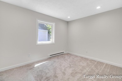 Enjoy views of Bostwick Lake from this completely updated home - photo 24