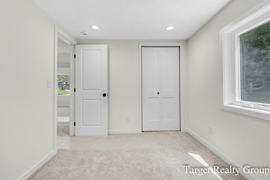 Enjoy views of Bostwick Lake from this completely updated home - photo 25