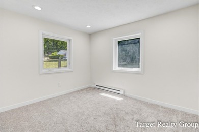 Enjoy views of Bostwick Lake from this completely updated home - photo 27