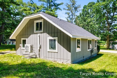 Enjoy views of Bostwick Lake from this completely updated home - photo 32