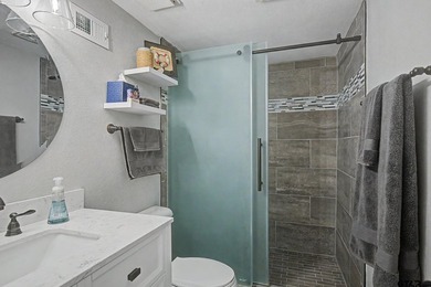 Water view, turnkey, low maintenance, updated and remodeled unit - photo 14