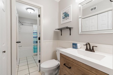 Enjoy coastal charm in this beautifully decorated 1 bed, 1.5 - photo 15