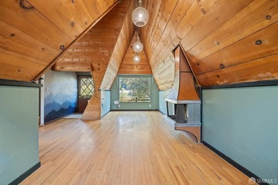 Perched above the street, this charming alpine-style cabin - photo 4