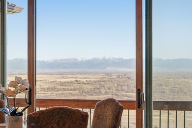 Perched above the Gallatin River with commanding, unobstructed - photo 16