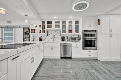 One of the finest three-bedroom waterfront residences in - photo 8