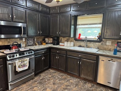 WATER FRONT HOME! Situated on a stunning 1.52 acre lot, this - photo 18