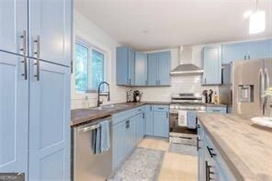 Nestled on a level lot just over half an acre, this beautifully - photo 1