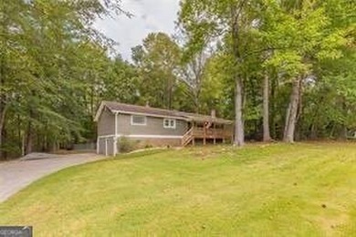 Nestled on a level lot just over half an acre, this beautifully - photo 3