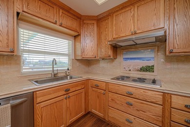 Canal front property with boat launch. This two-story, two-lot