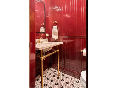 Stunningly renovated in 2024, this 4-bedroom, 3 full bath and 1 - photo 13