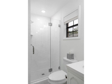 Stunningly renovated in 2024, this 4-bedroom, 3 full bath and 1 - photo 18