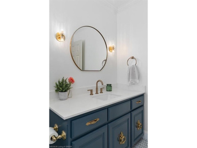 Stunningly renovated in 2024, this 4-bedroom, 3 full bath and 1 - photo 25
