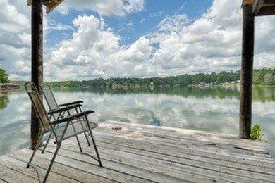 Sitting on the water in Hideaway Lake, this spacious 4-bedroom - photo 1