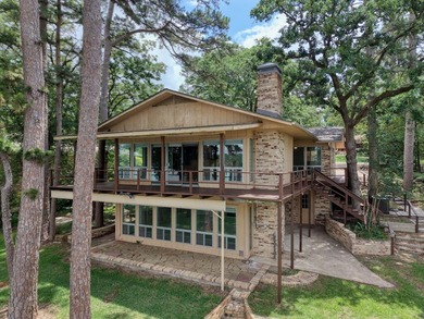 Sitting on the water in Hideaway Lake, this spacious 4-bedroom - photo 2