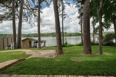 Sitting on the water in Hideaway Lake, this spacious 4-bedroom - photo 5