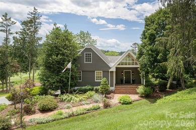 Set on a private .7-acre lot in North Asheville, this 3-bedroom - photo 1
