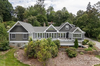 Set on a private .7-acre lot in North Asheville, this 3-bedroom - photo 2