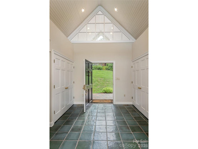 Set on a private .7-acre lot in North Asheville, this 3-bedroom - photo 4