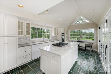 Set on a private .7-acre lot in North Asheville, this 3-bedroom - photo 8