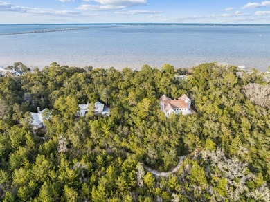 This exceptional 0.33-acre homesite offers bay views within the - photo 3
