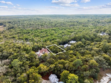 This exceptional 0.33-acre homesite offers bay views within the - photo 7