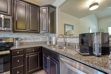 Enjoy low-maintenance living in the highly desirable River Falls - photo 11